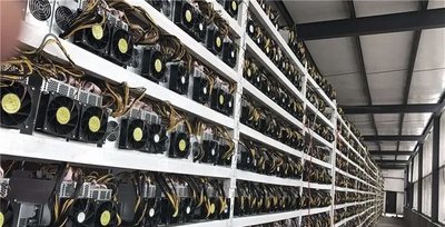 Quiet mining farm utilizing low noise Bitcoin rigs for sustainable operation